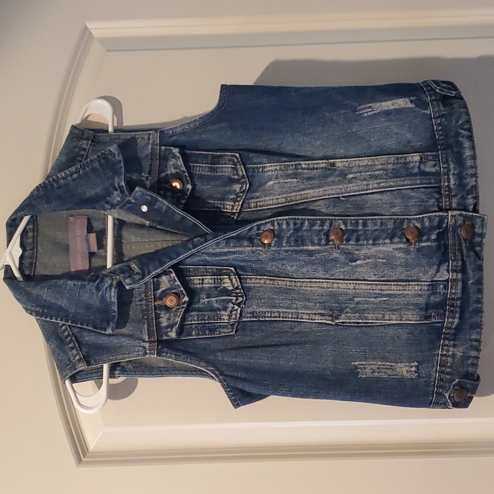 Distressed denim vest
